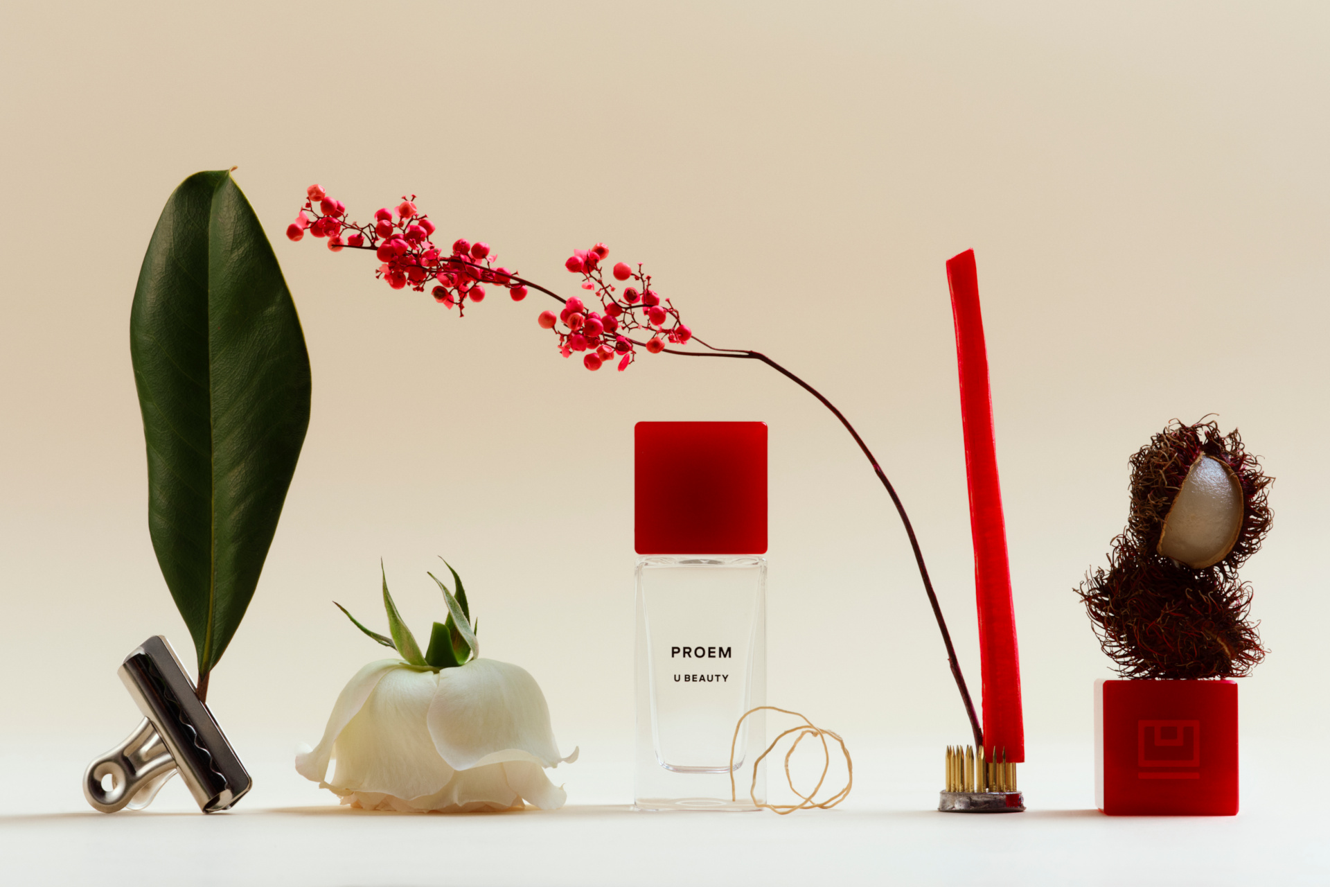 Perfume bottle surrounded by still life items