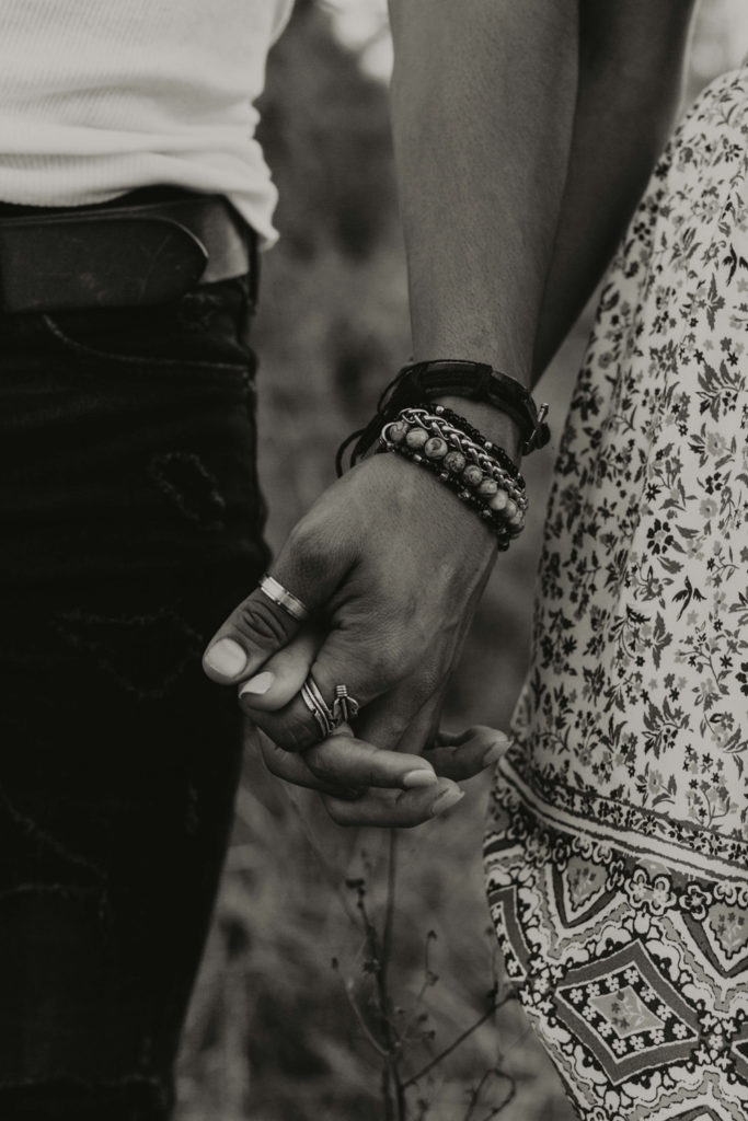 Two people holding hands
