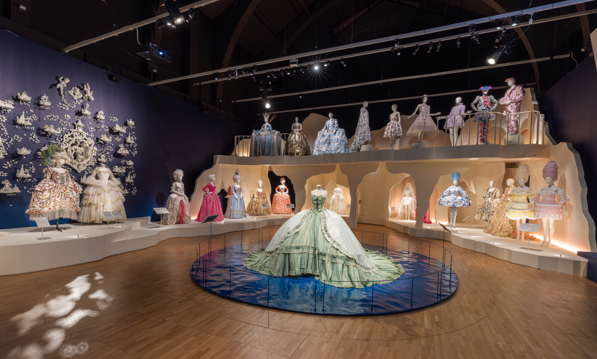 Marie Antoinette exhibition at the V&A - room with filled with ornate dresses inspired by the French queen