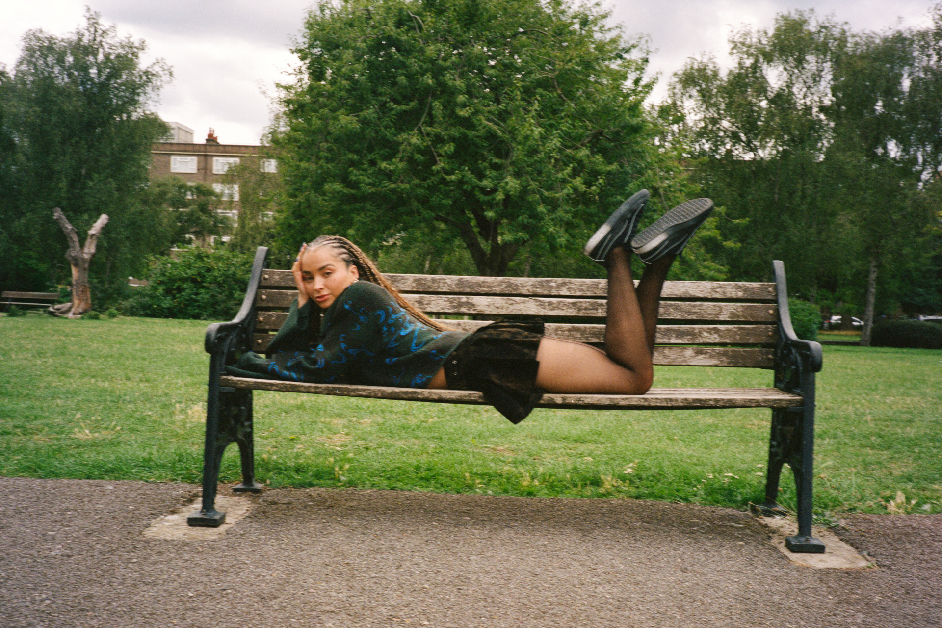 Woman lying on bench