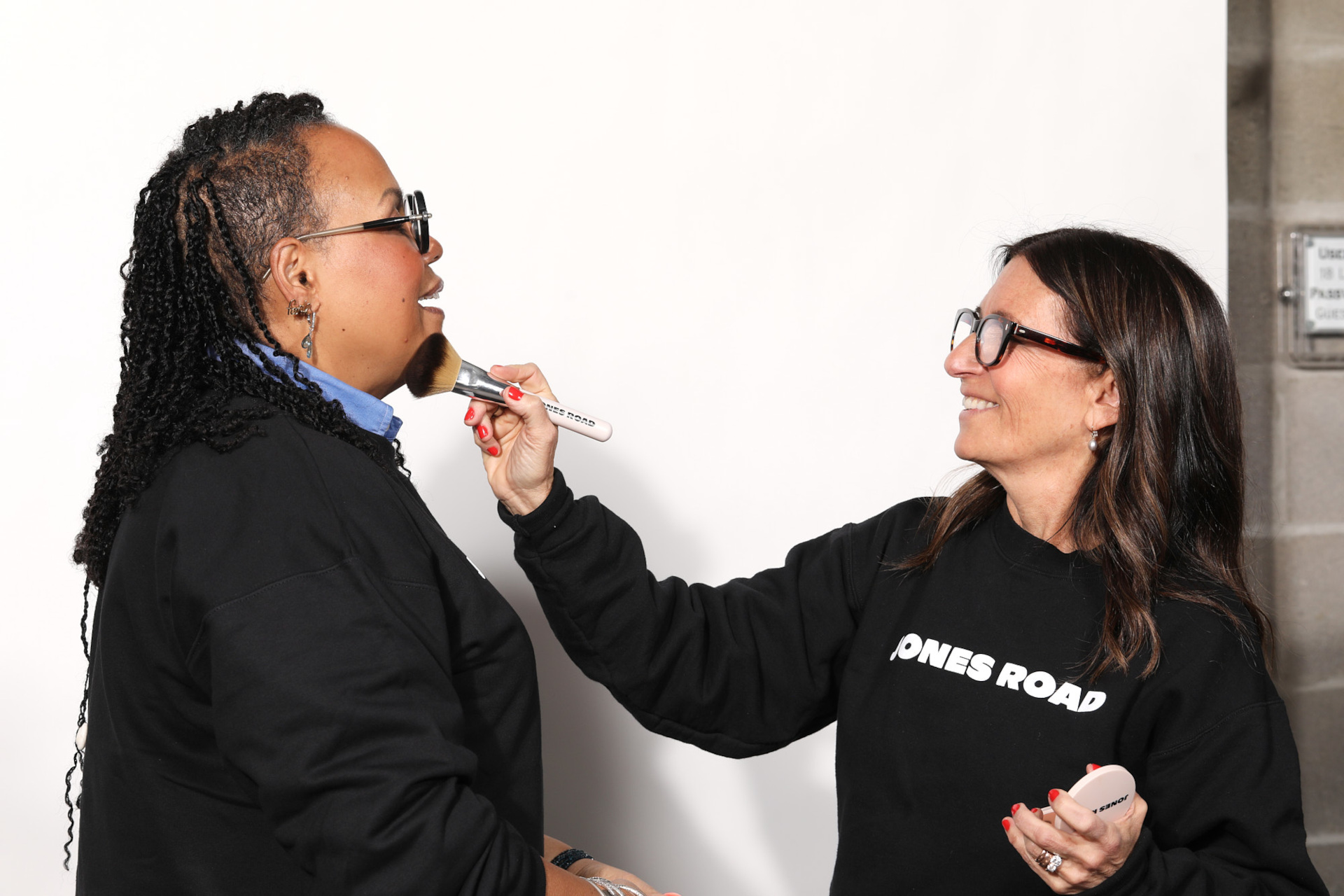 Woman getting her makeup done