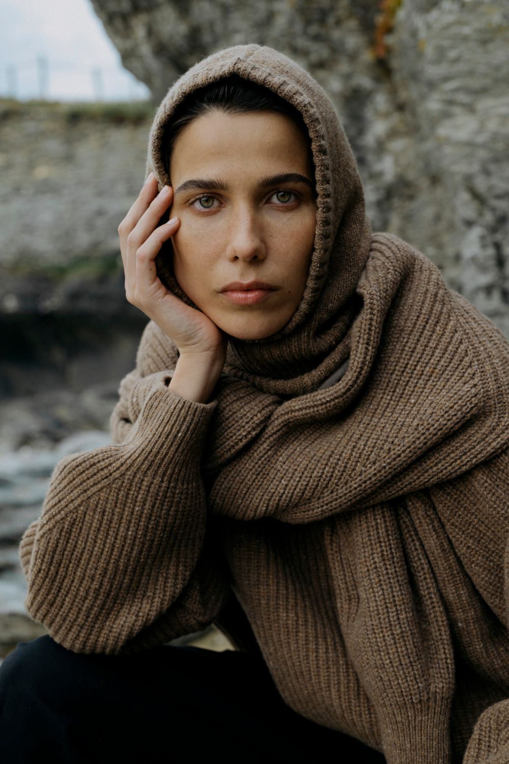 Woman in knitted jumper and hood