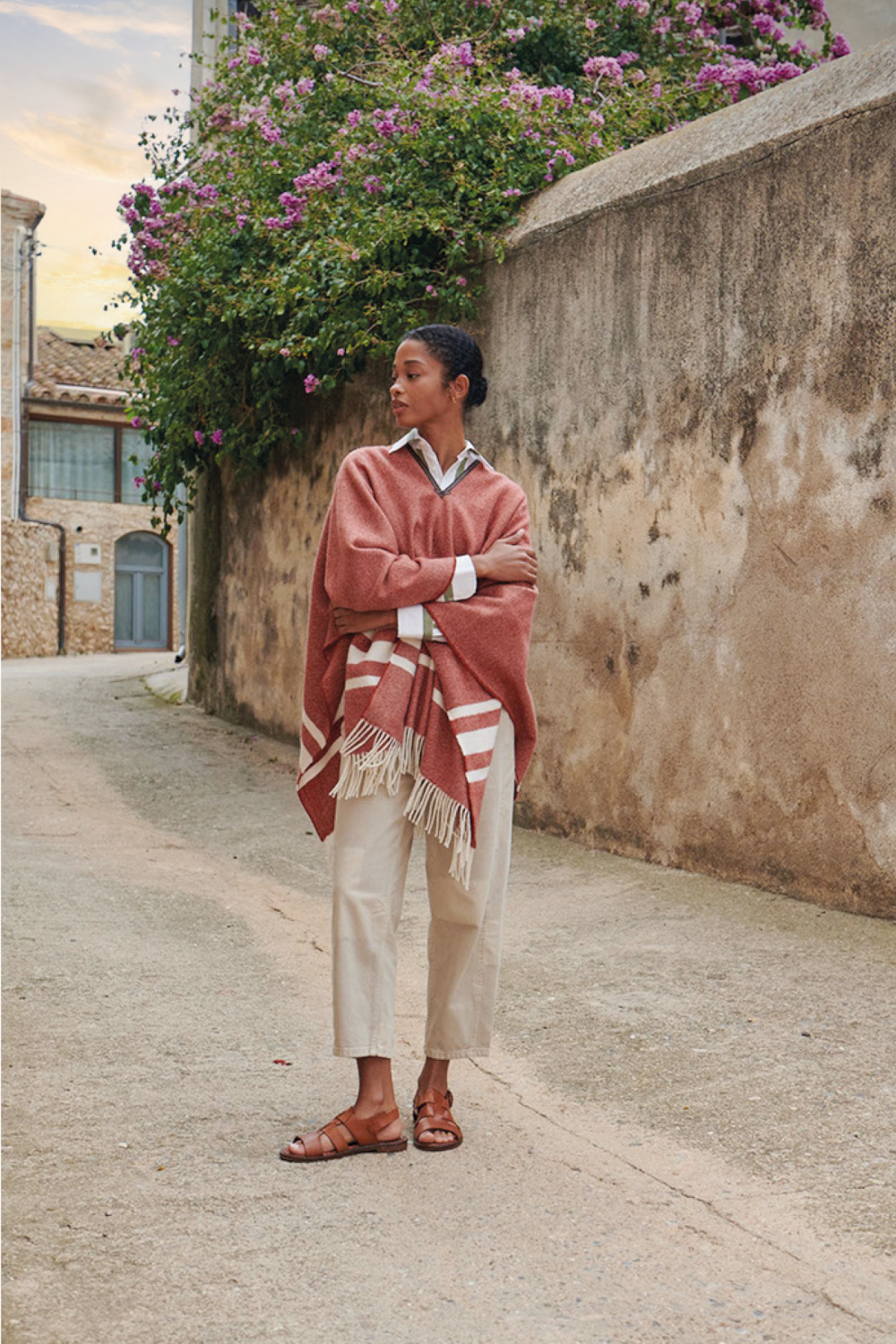 Woman wearing pink poncho