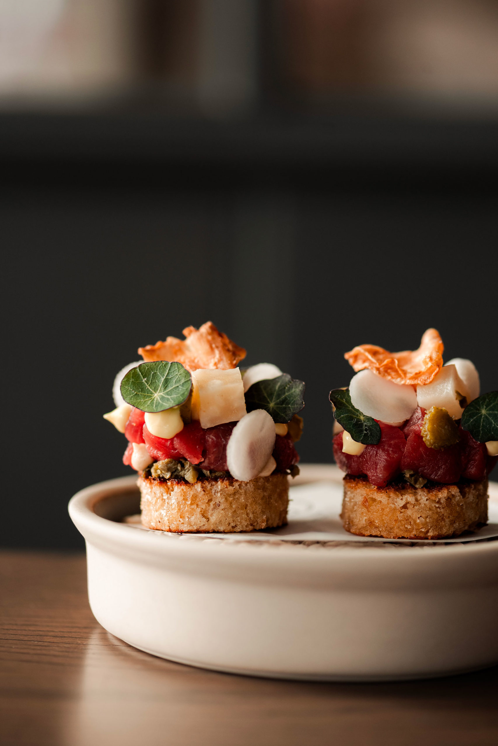 Chopped beef tartar presented on small muffin 