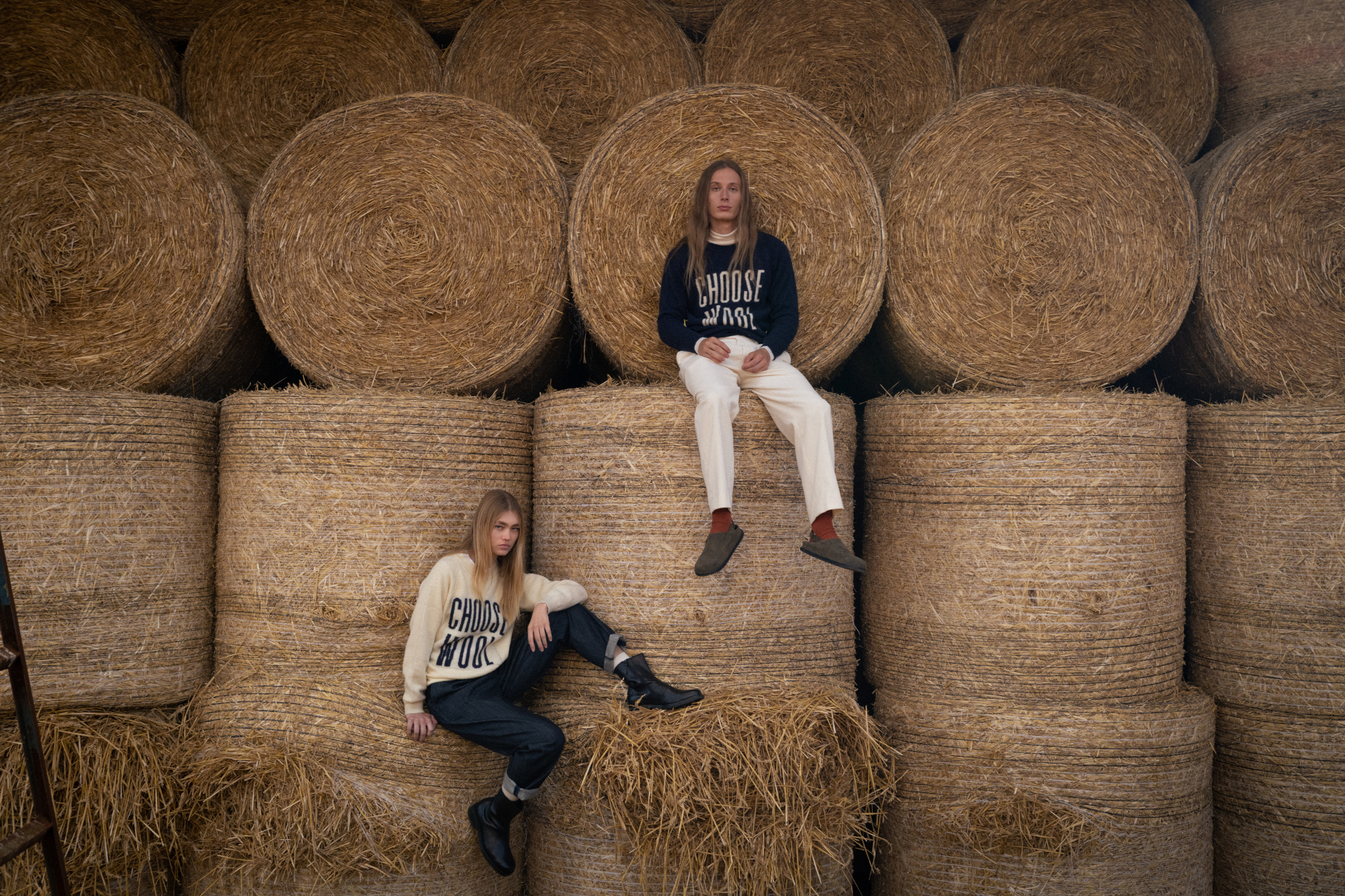Models sat on hay bales