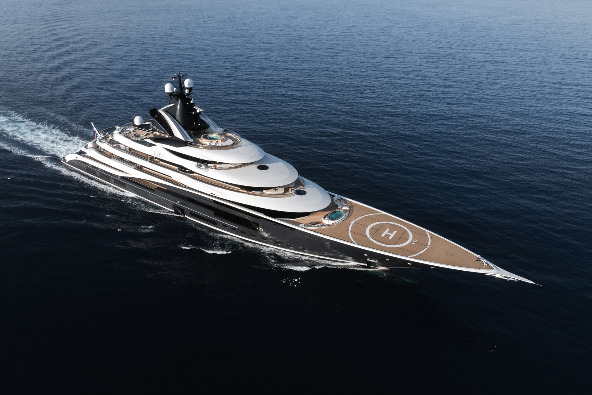 A yacht with a helipad on the sea