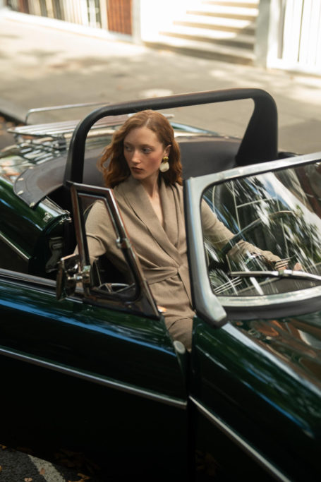 Woman sat in convertible car