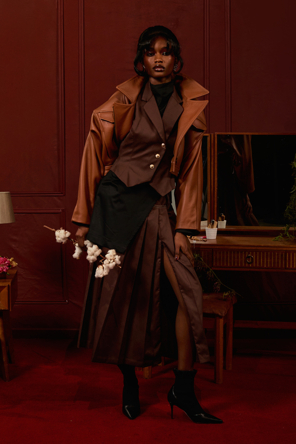 Model posing on red background