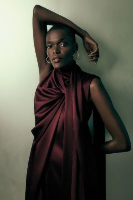 Sheila Atim in burgundy dress