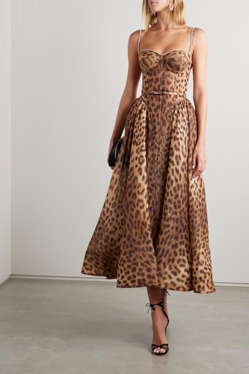Woman in leopard print dress | autumn wedding guest dresses