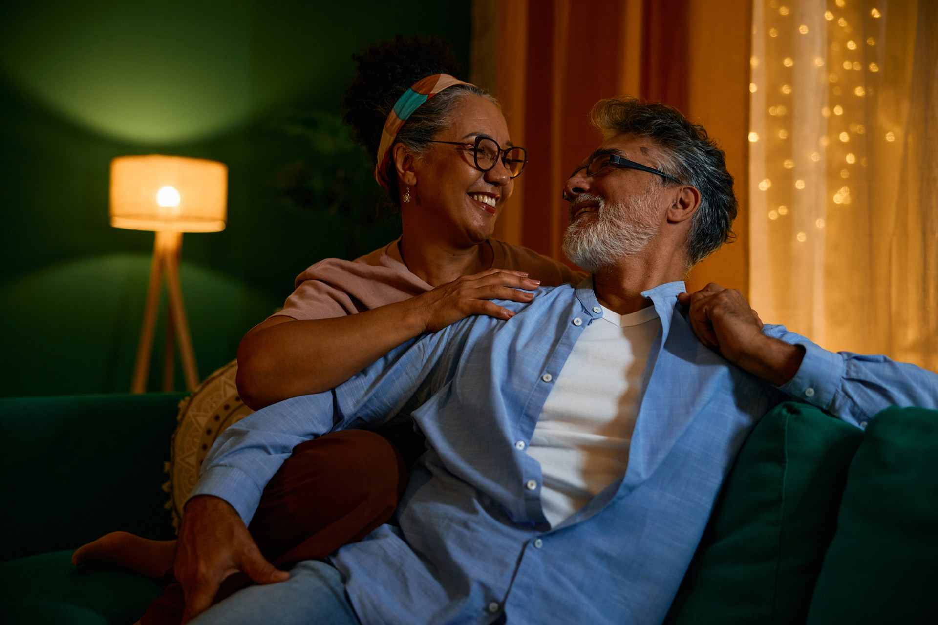 A couple sitting on a sofa