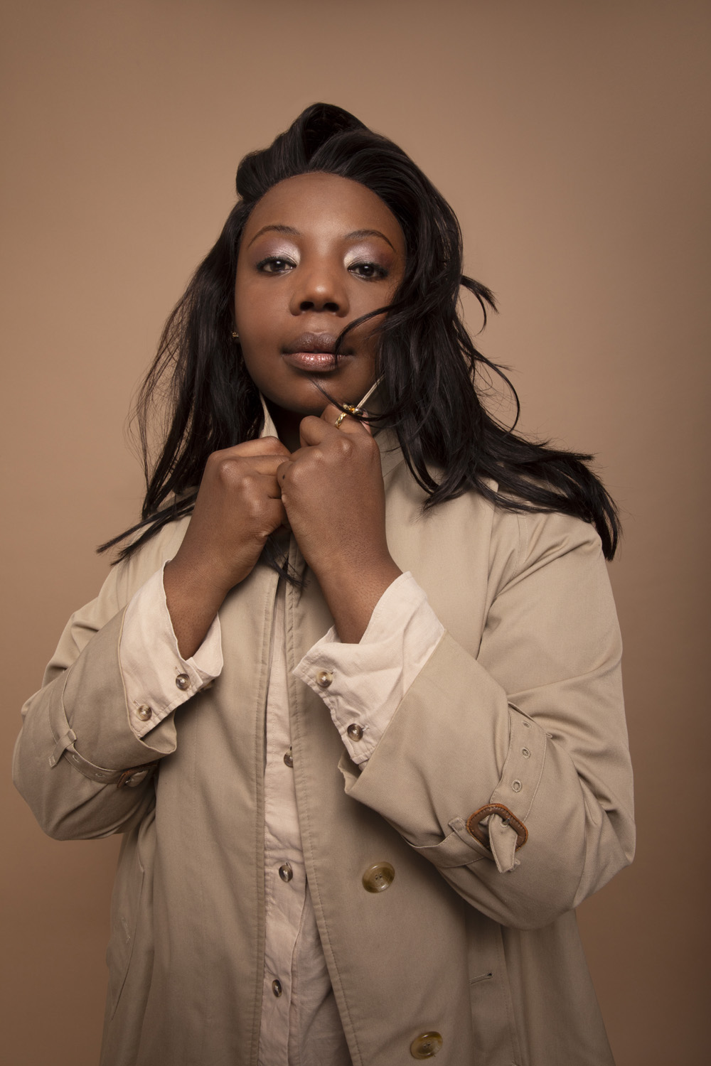 Mimî M Khayisa in a beige coat