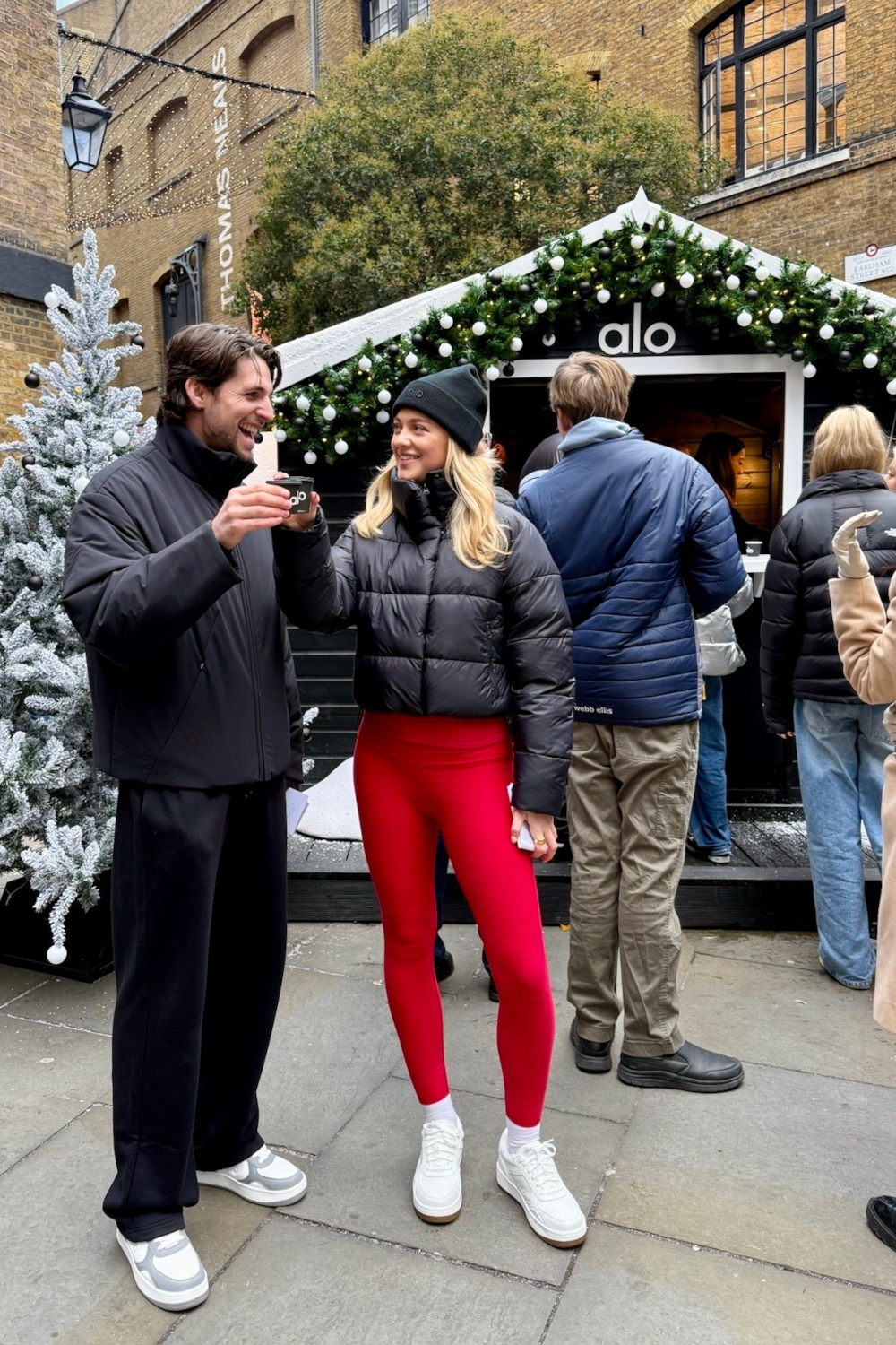 People in workout gear stood in front of Alo pop-up