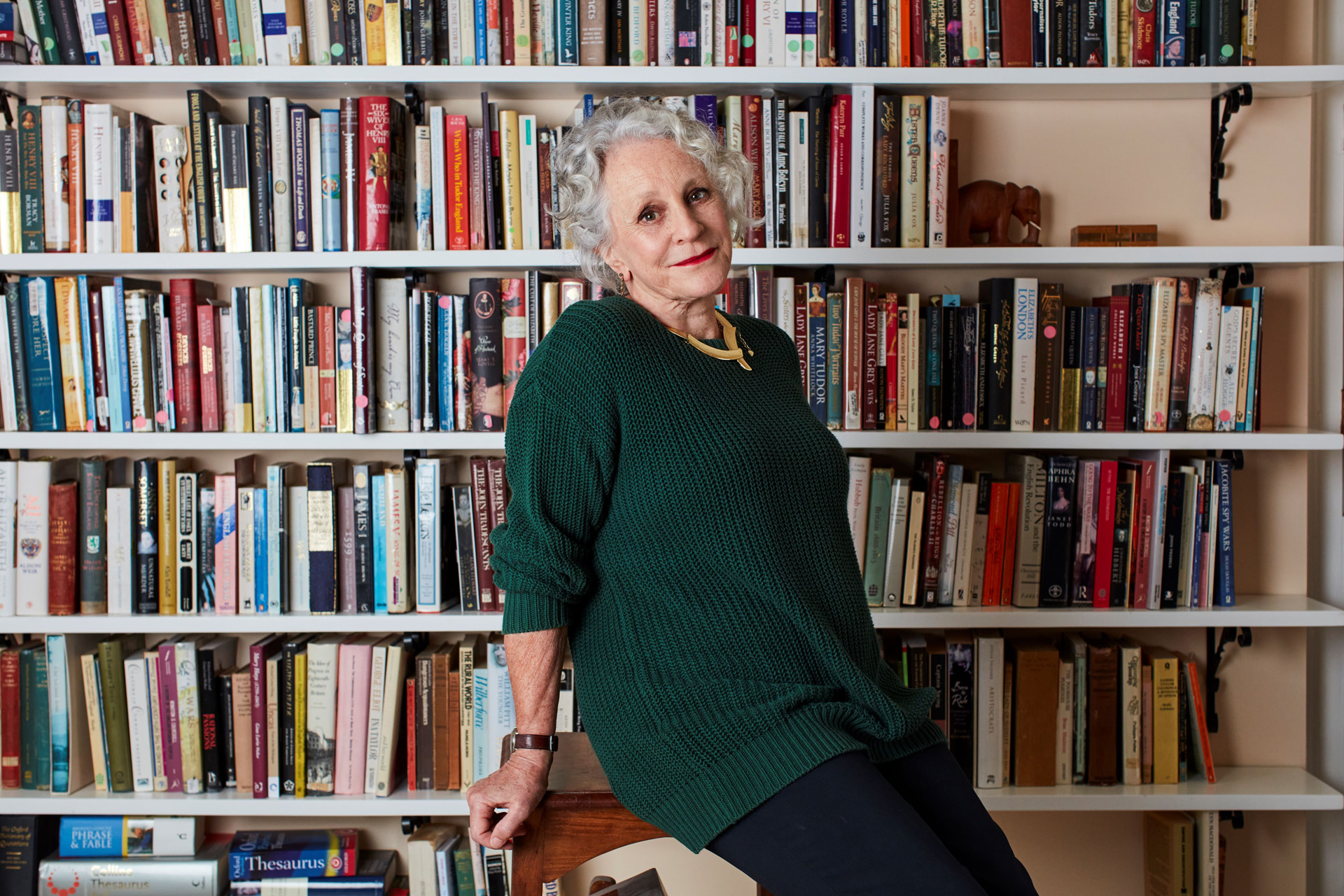 Philippa Gregory in front of her book case