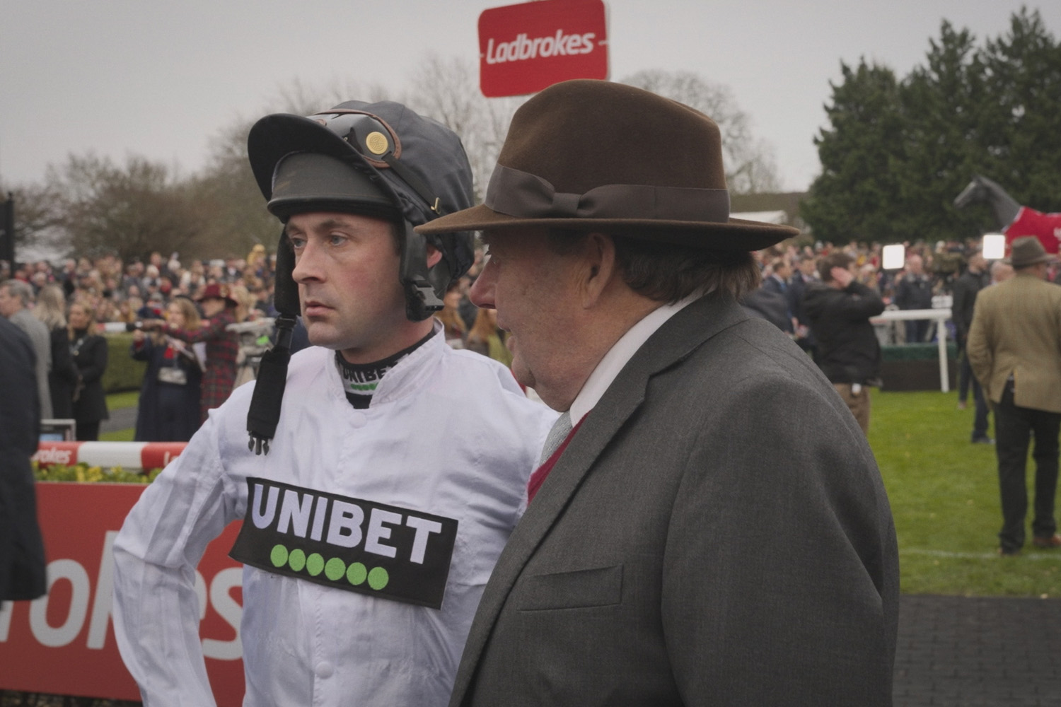 Trainer Nicky Henderson with jockey Nico de Boinville ahead of the Ladbrokes Christmas Hurdle in Champions: Full Gallop