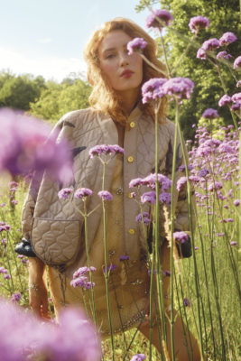 A woman in a field of flowers