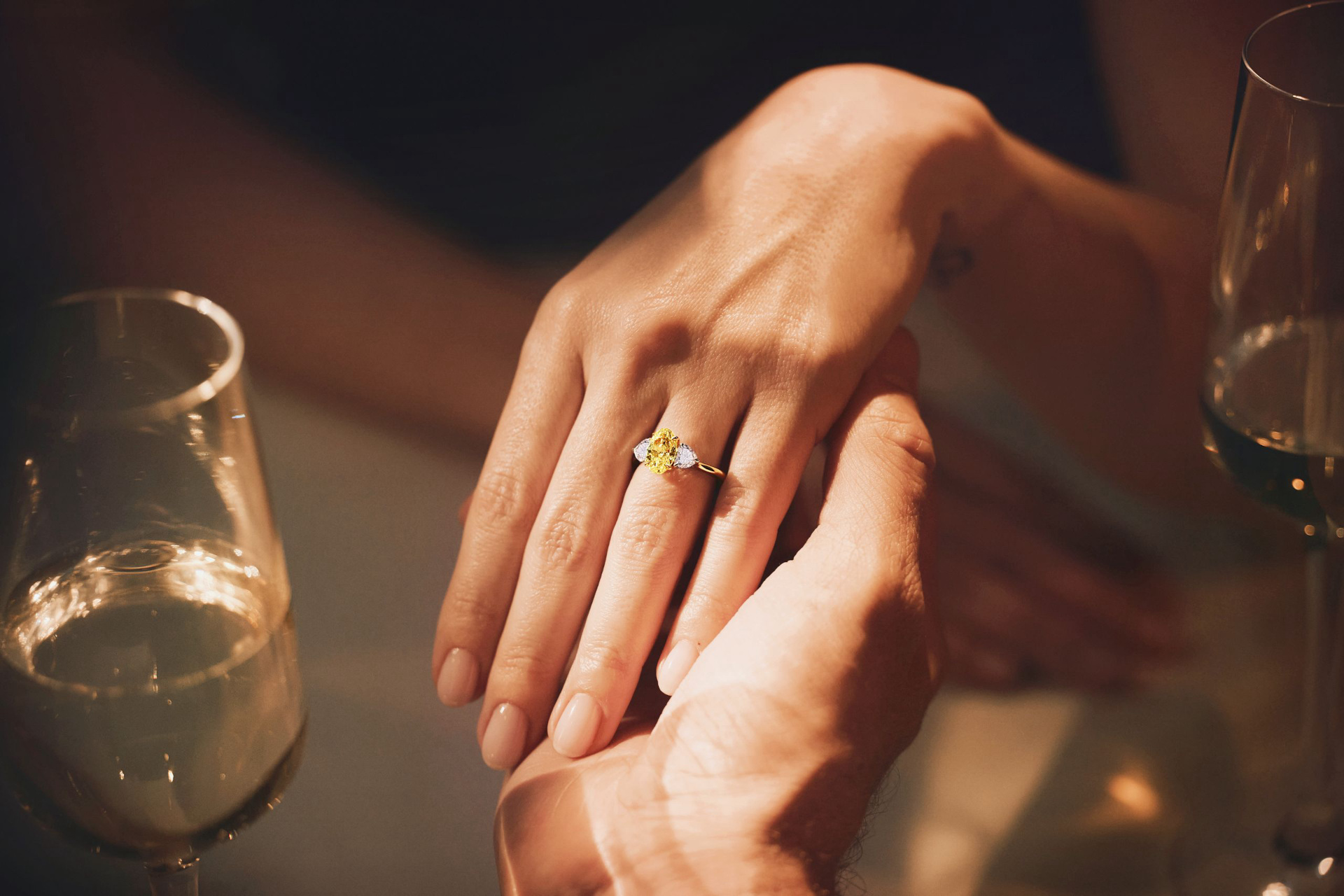 Someone holding another person's hand in theirs