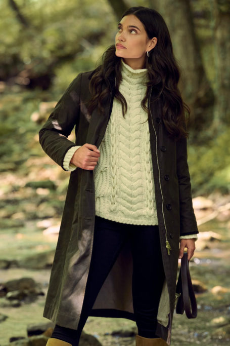 Woman in jumper and wax coat