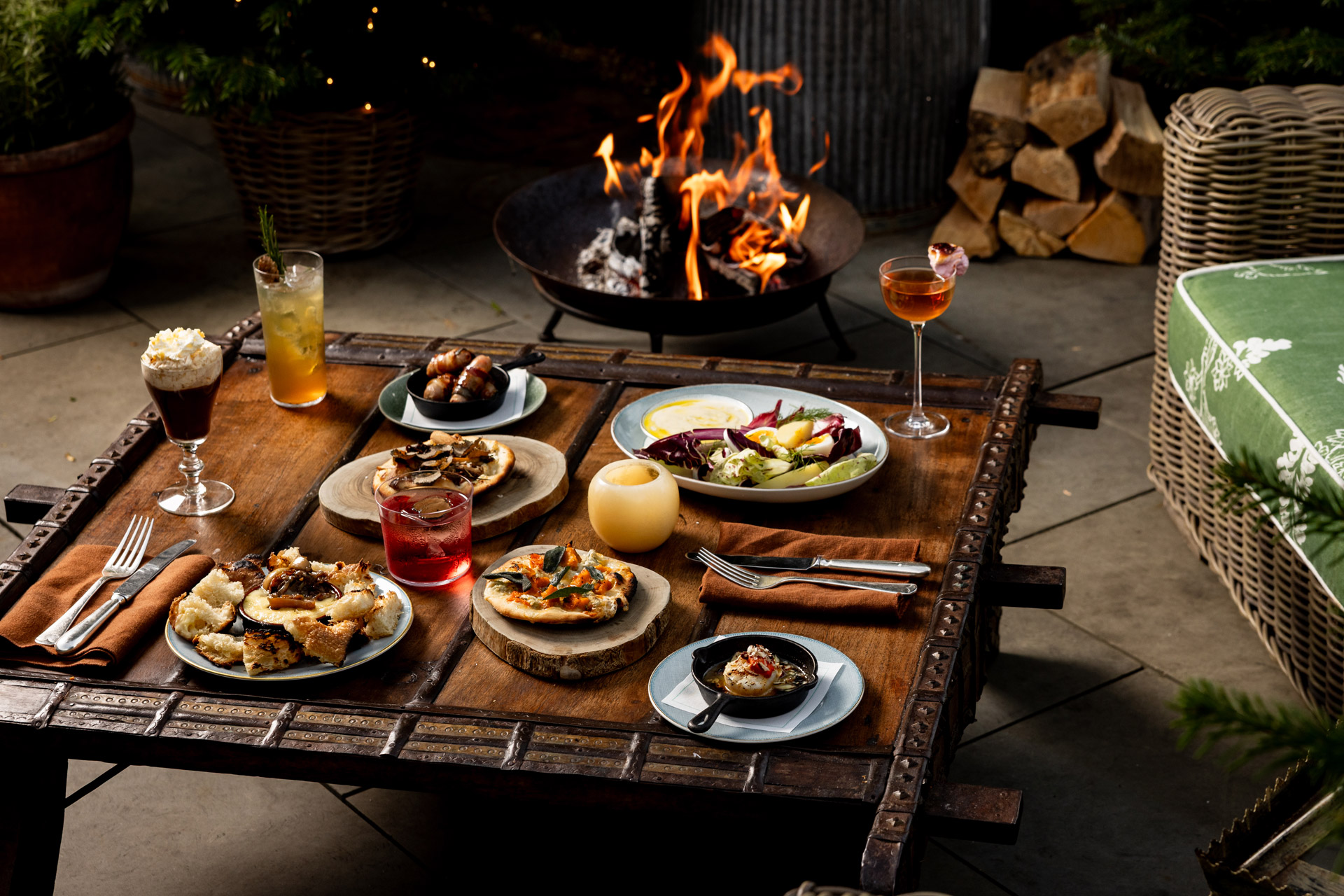 Plates of winter food on the rooftop terrace at Ham Yard Hotel