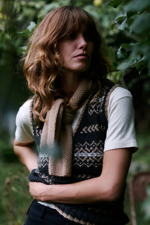 Woman in sweater vest