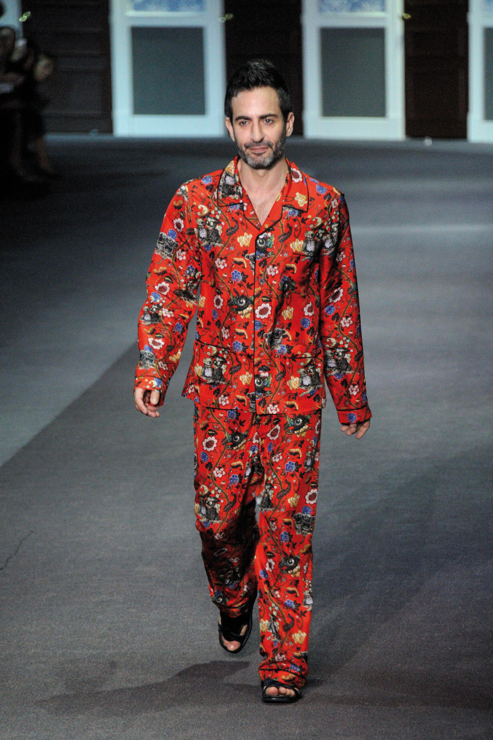 Designer Marc Jacobs appears on the catwalk at the end of the Louis Vuitton collection show