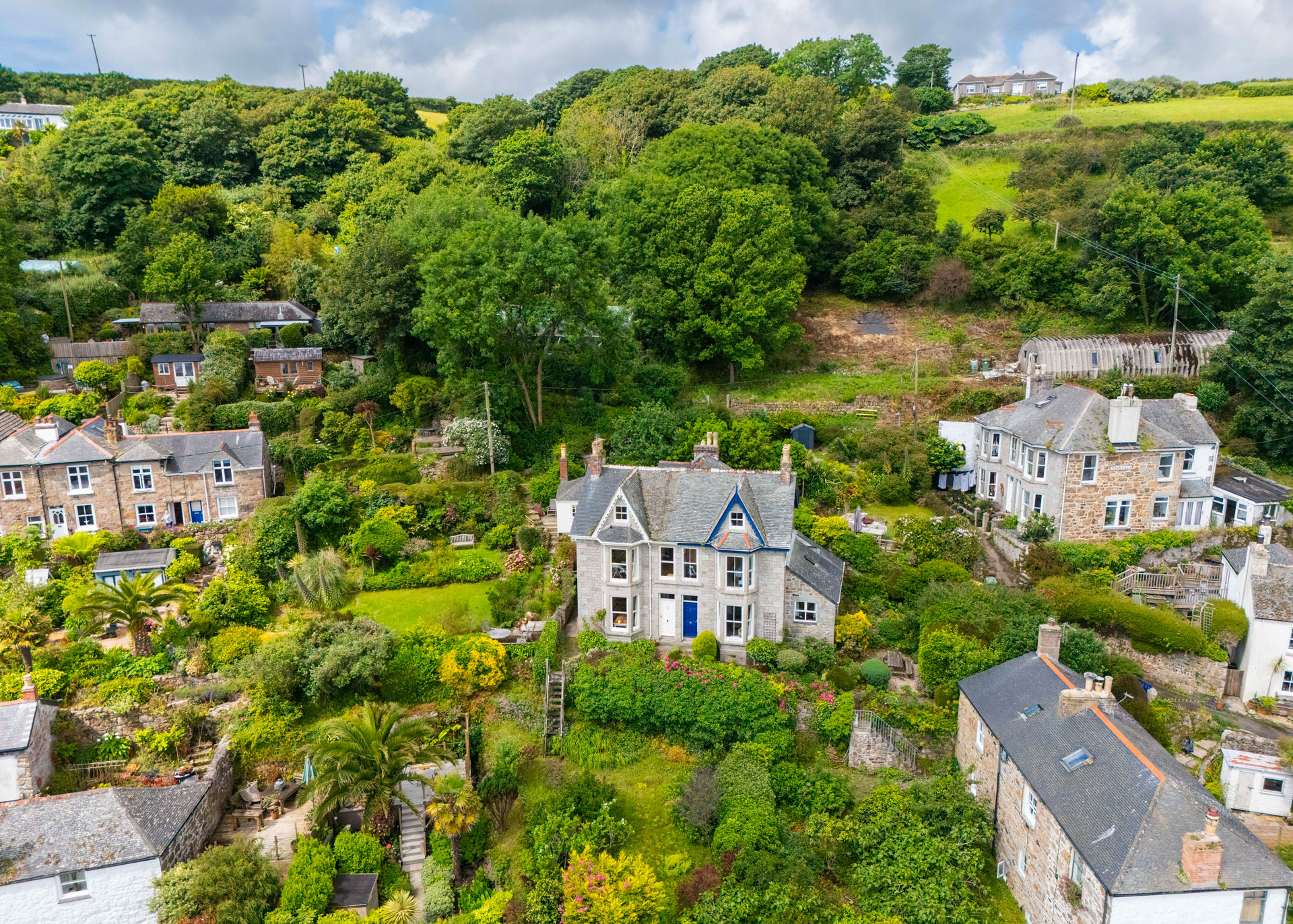 A house in among trees in Mousehole, Cornwall