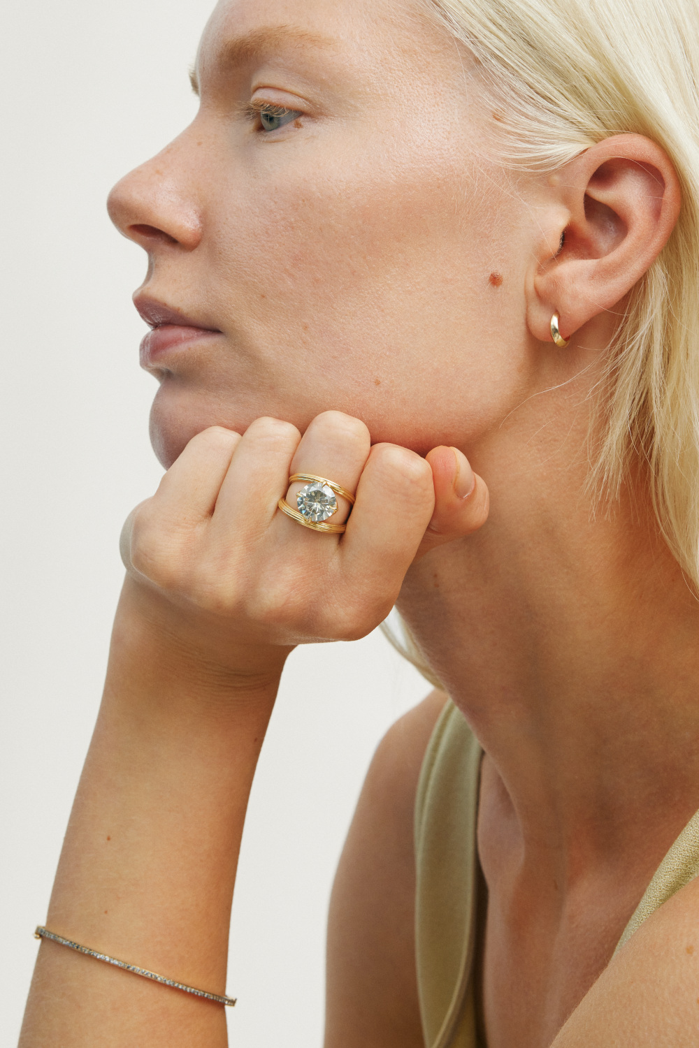 Woman leaning head on hand