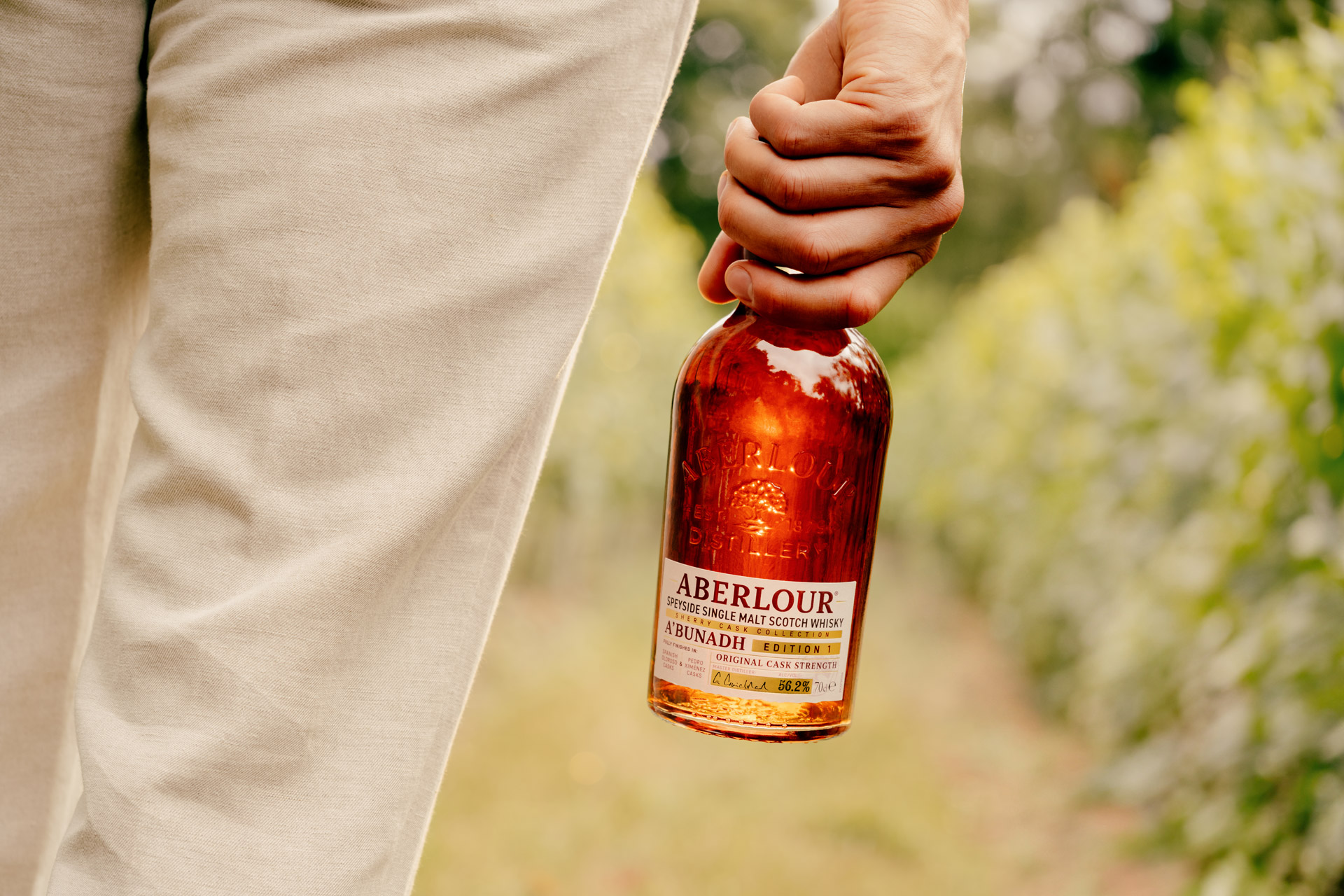 Man holding bottle of Aberlour whisky