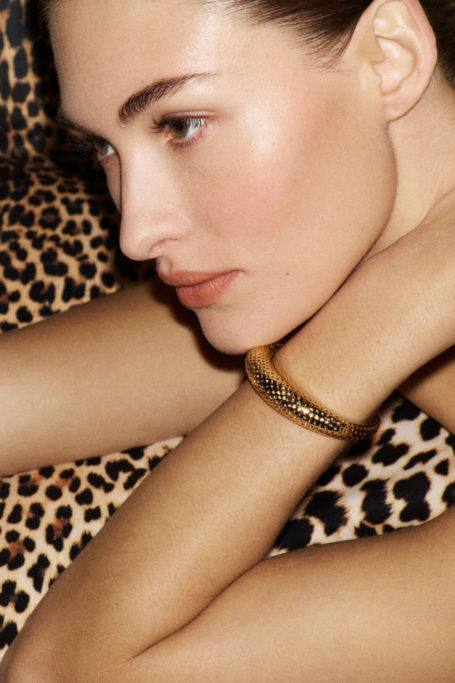 Woman on leopard print throw