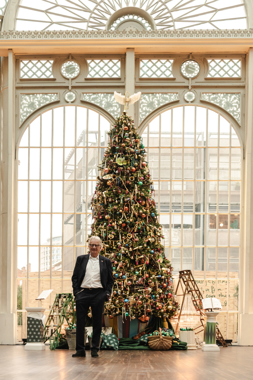 Paul Smith in front of his Christmas tree at the Royal Opera House