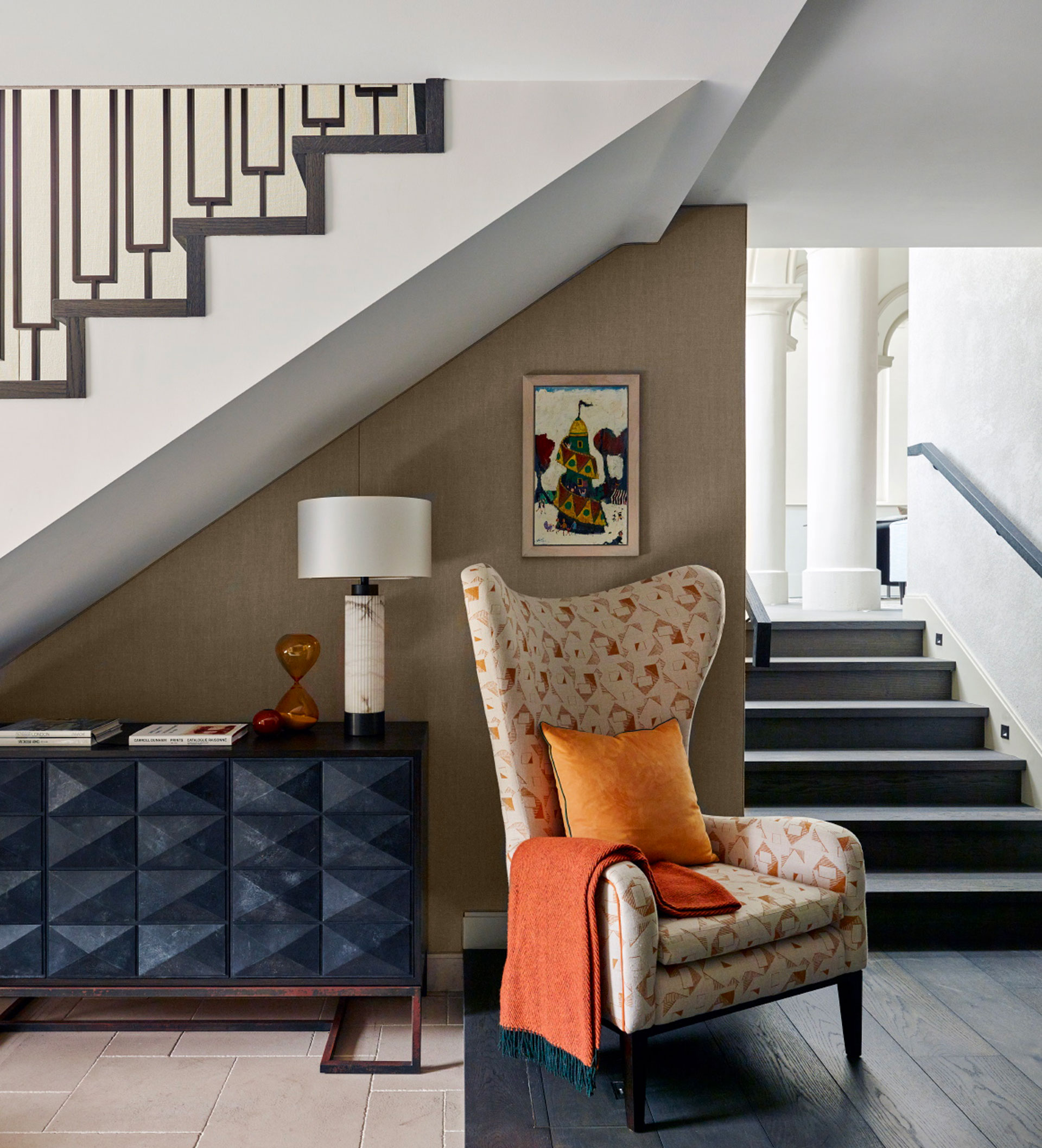 A hallway with an arm chair