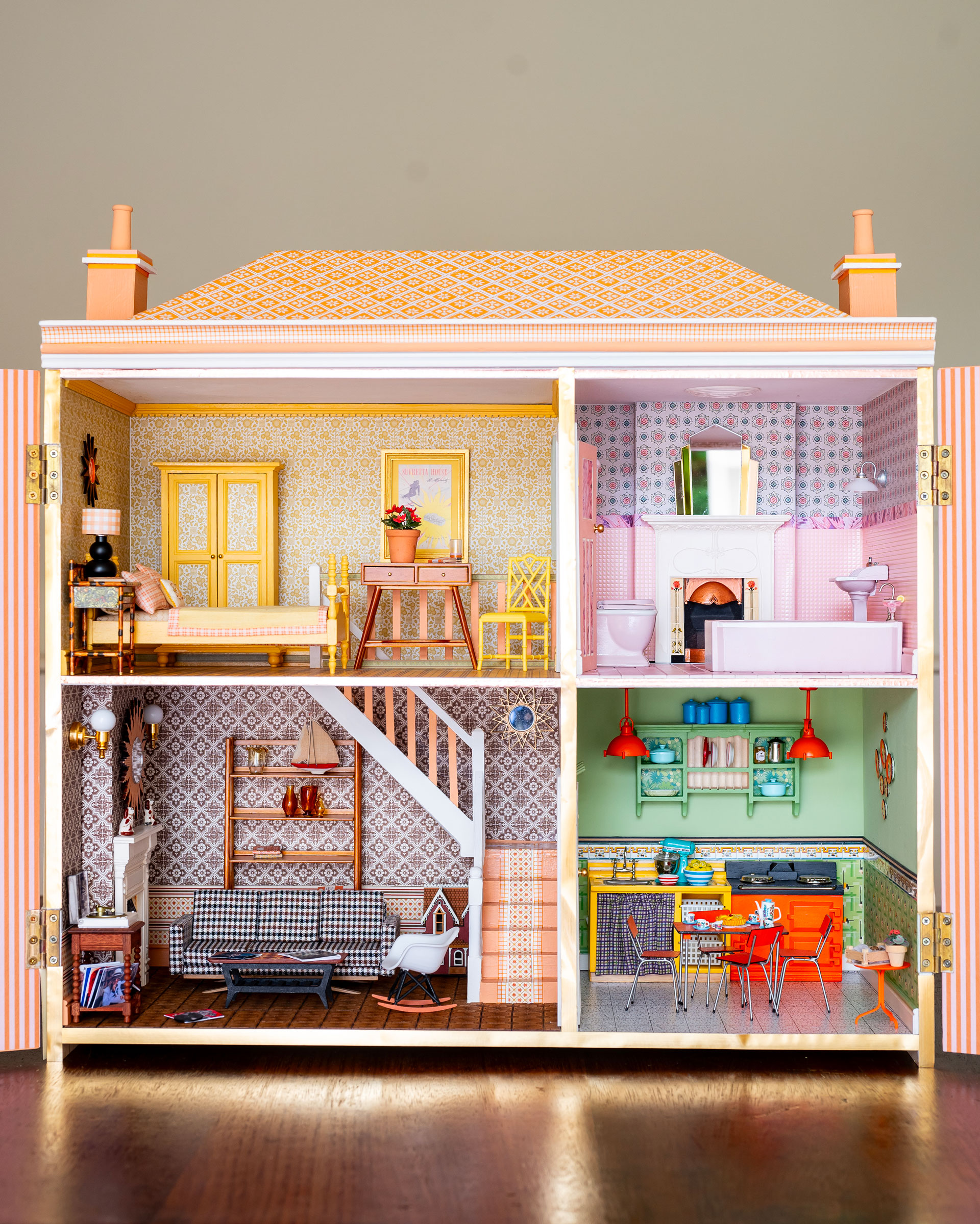 A colourful doll's house in a 1970s/1980s style