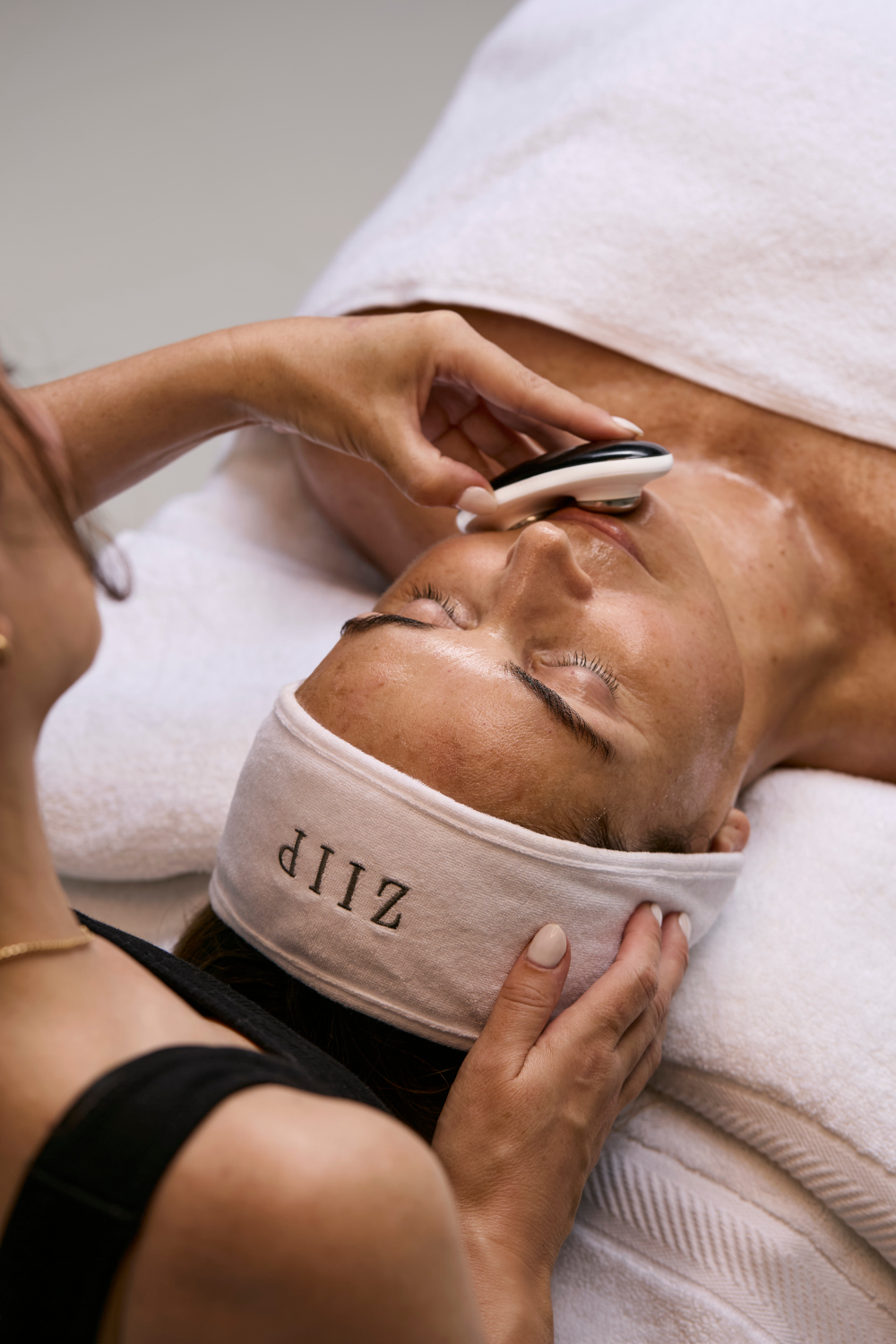 Woman receiving a facial
