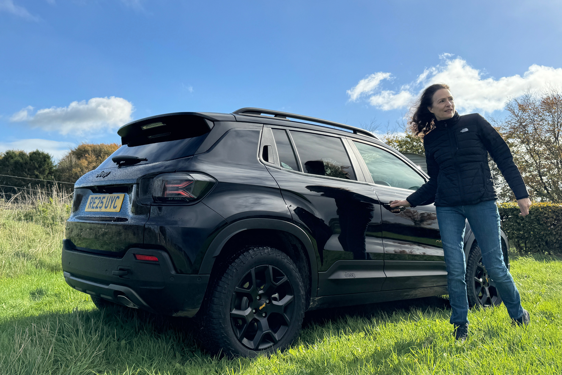 Woman stood next to car
