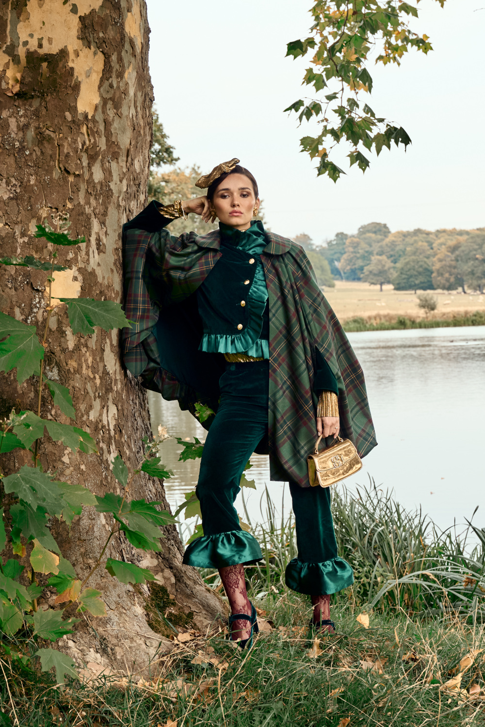 Woman leaning on tree