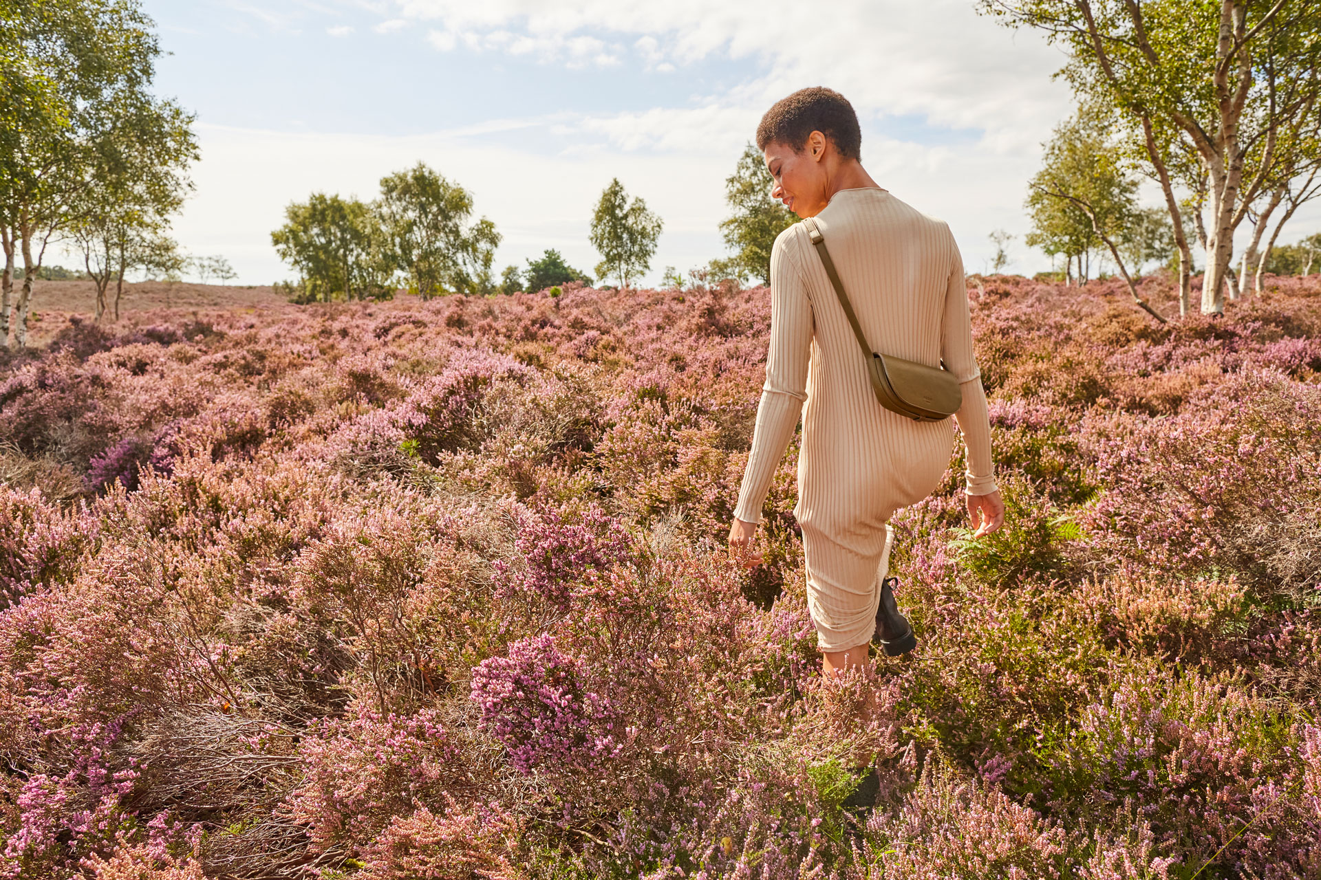 A model walks through a field