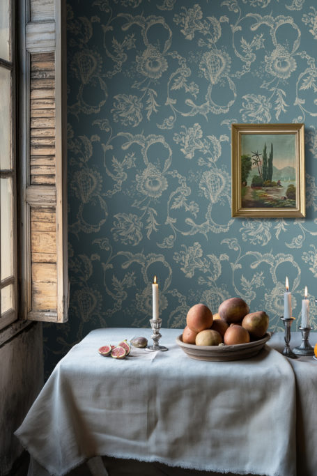Room with blue wallpaper