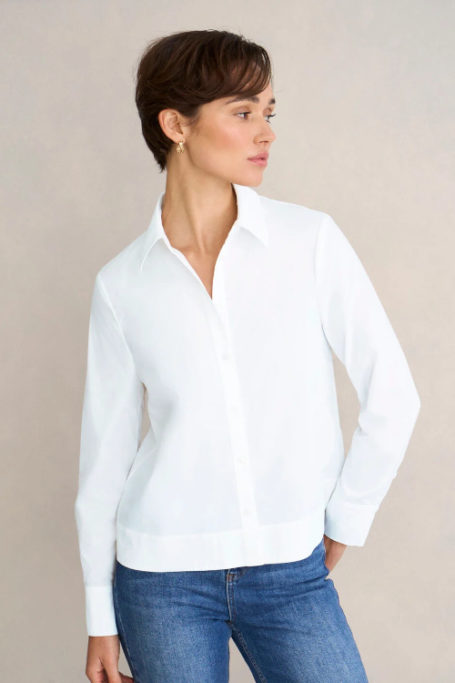 Woman in white shirt and jeans
