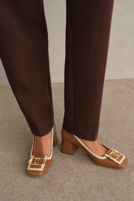 Feat wearing brown court shoes