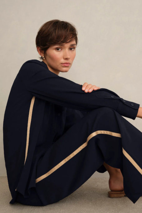 Woman in black shirt and trousers