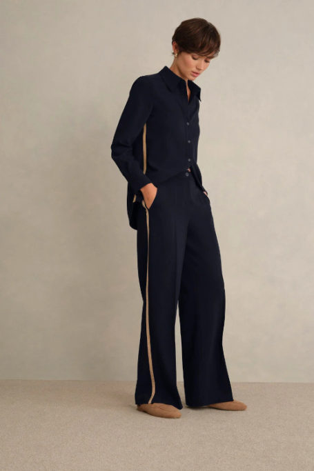 Woman in black shirt and trousers