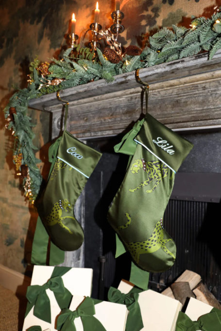 Green silk stockings hung on mantel