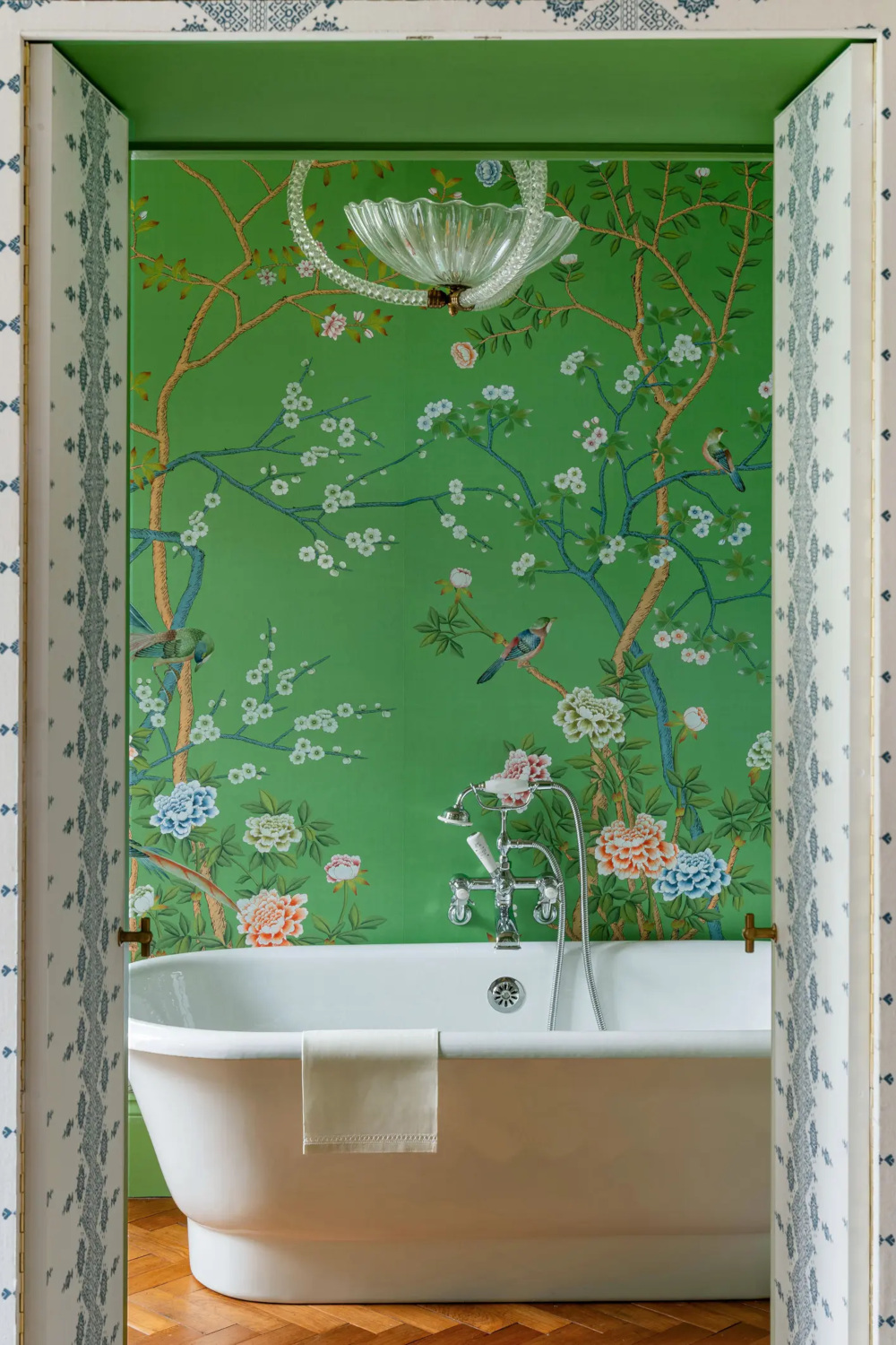 Green floral wallpaper in bathroom