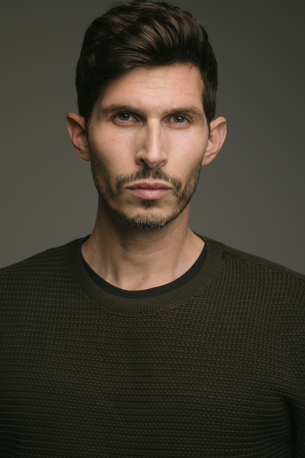 Close up of Alexander Devrient in a dark jumper