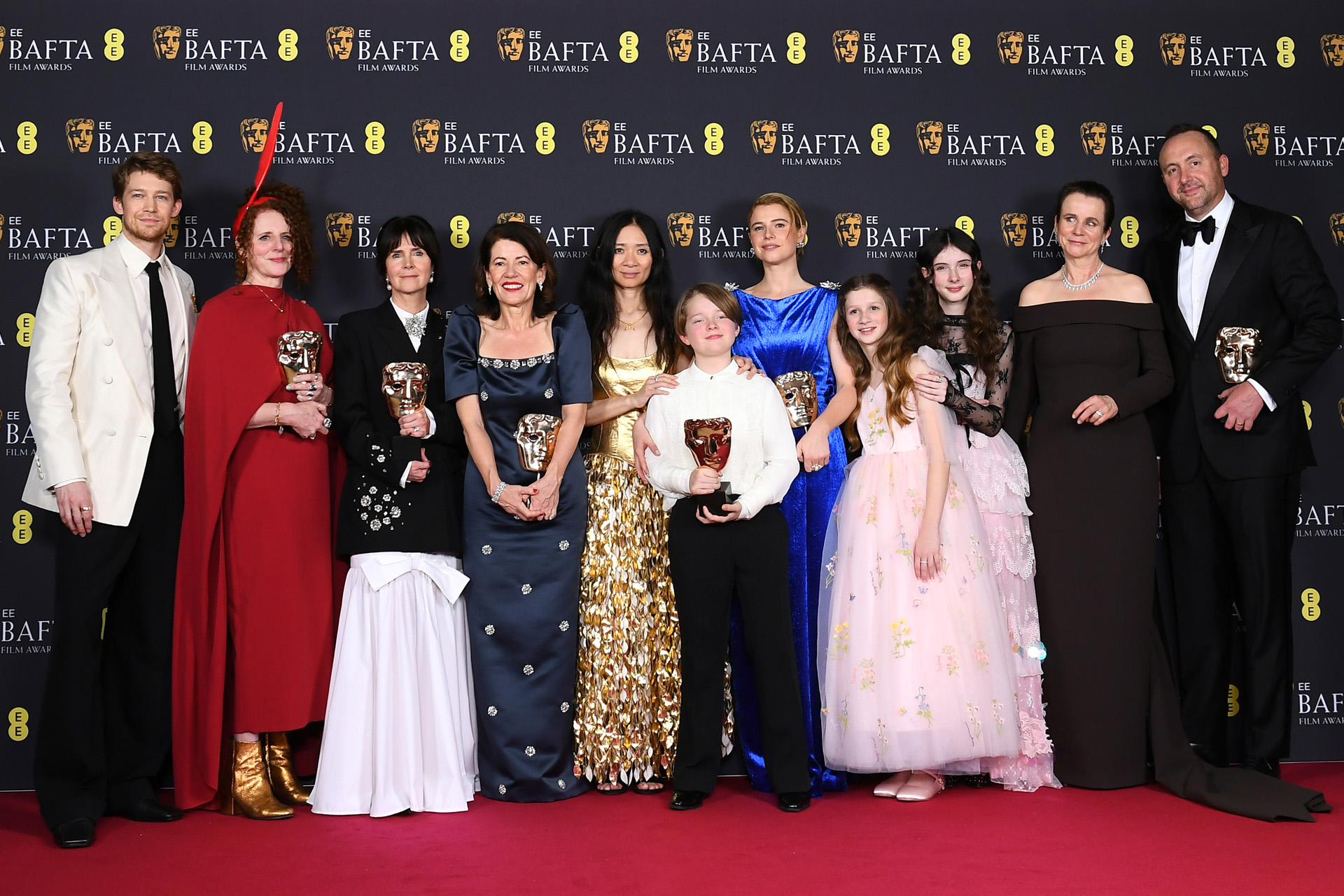 Joe Alwyn, Maggie O'Farrell, Liza Marshall, Dame Pippa Harris, Chloé Zhao, Jacobi Jupe, Jessie Buckley, Olivia Lynes, Bodhi Rae Breathnach, Emily Watson and Nicolas Gonda with the Outstanding British Film Award for 'Hamnet' during the 2026 EE BAFTA Film Awards.