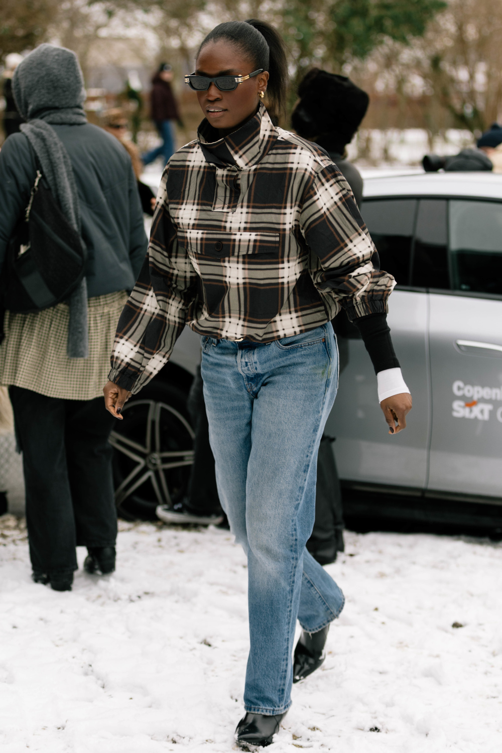Woman wearing checked jacket