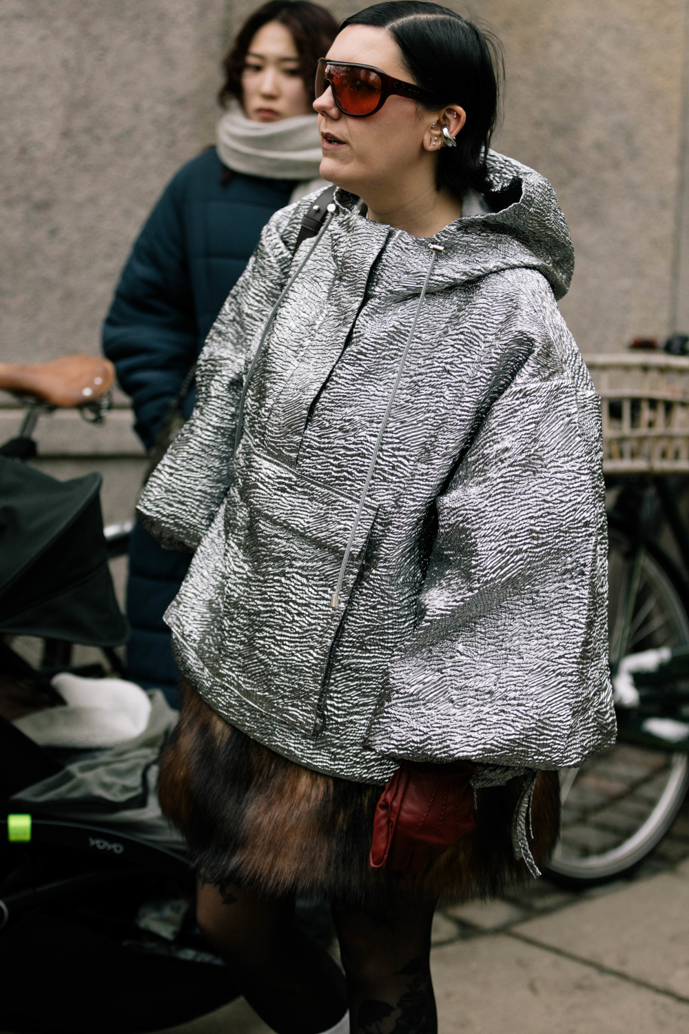 Woman wearing metallic coat