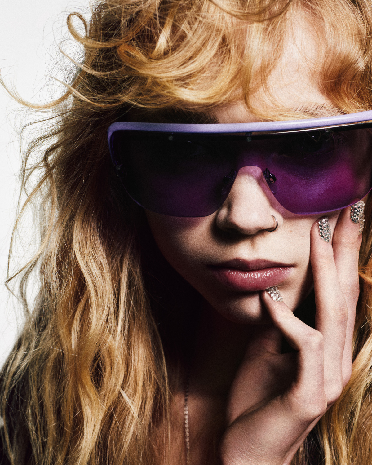 Close up of woman wearing purple sunglasses