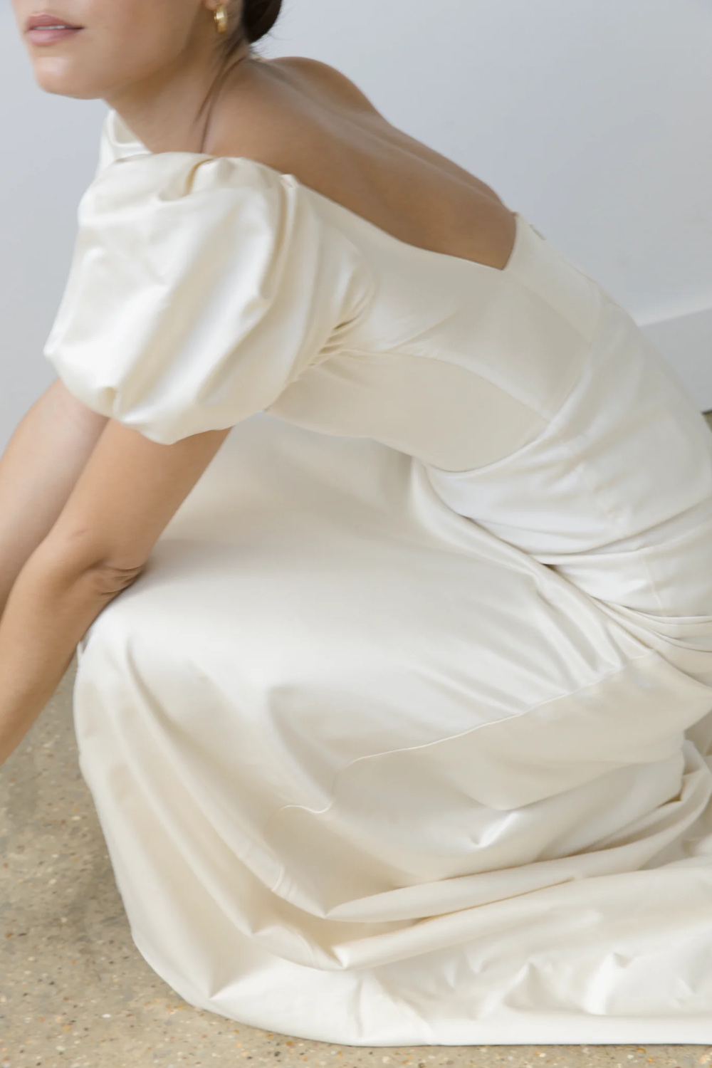 Woman in dress by British wedding dress designer Clover London