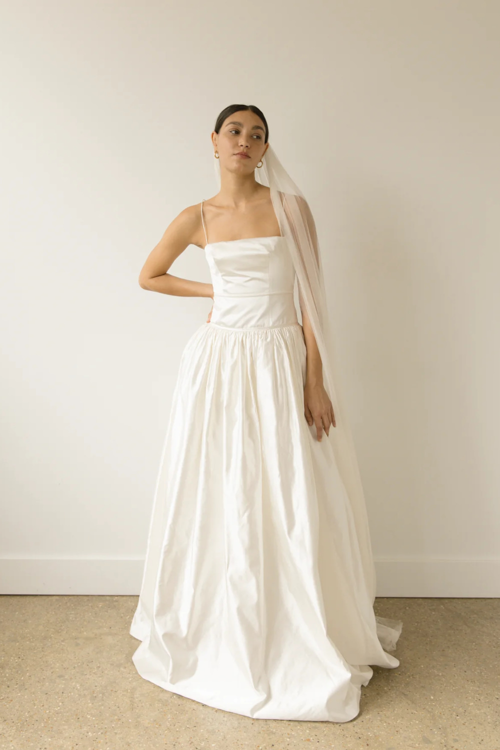 Woman in dress by British wedding dress designer Clover London